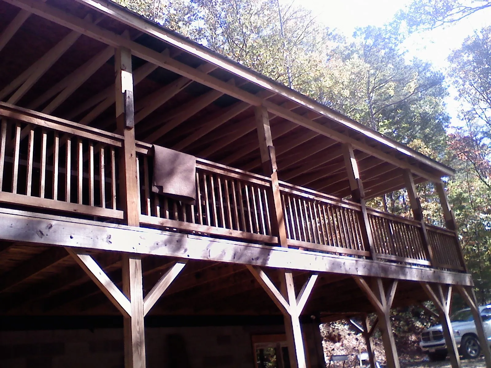Timber framing under a new elevated porch and deck — Roof Leak Repair in Harbor View by Roofing Brothers
